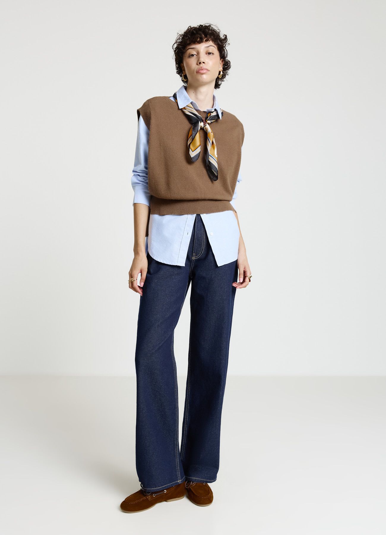 Gilet con bottoni laterali