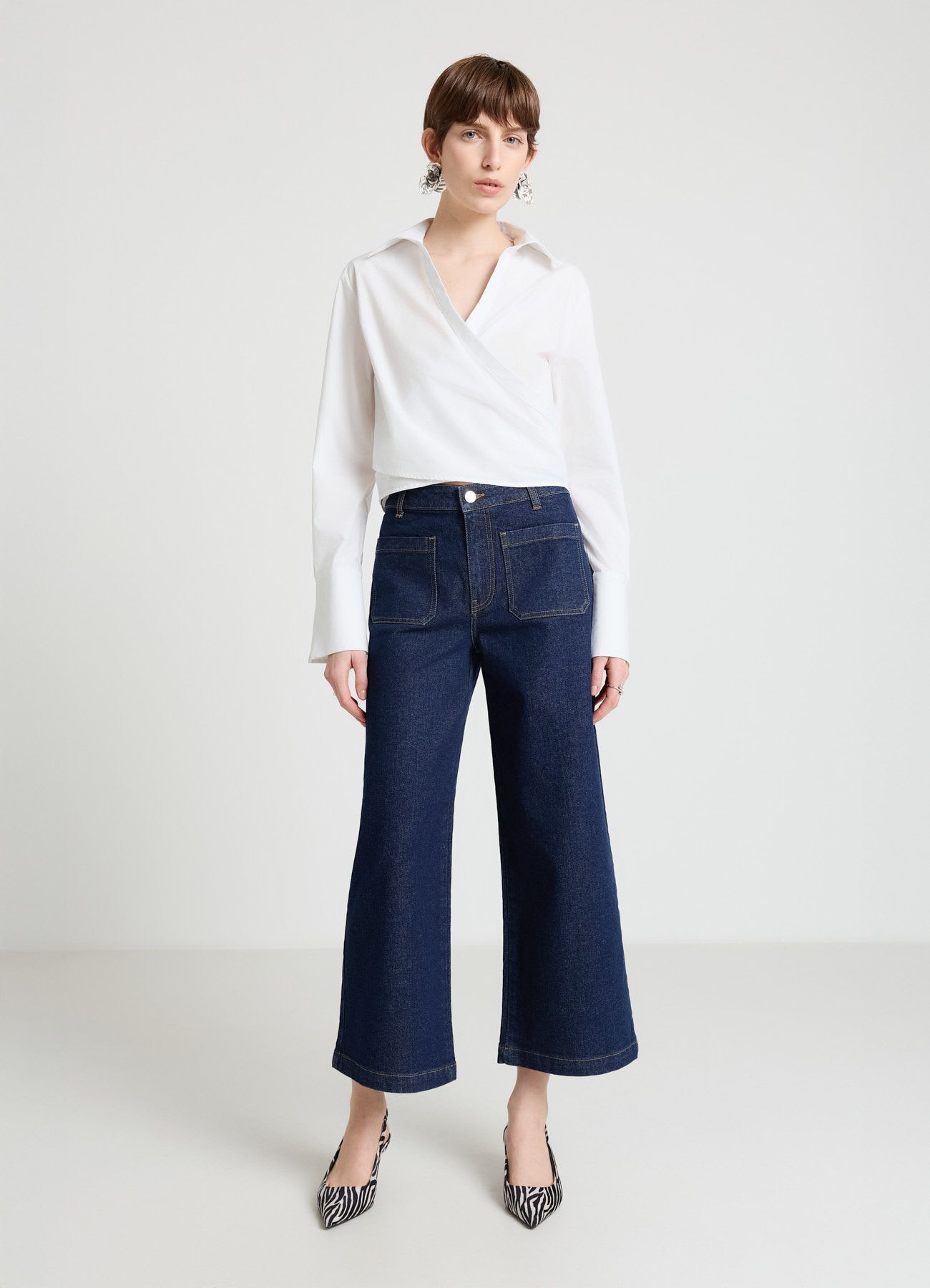 Jeans culotte con tasche applicate