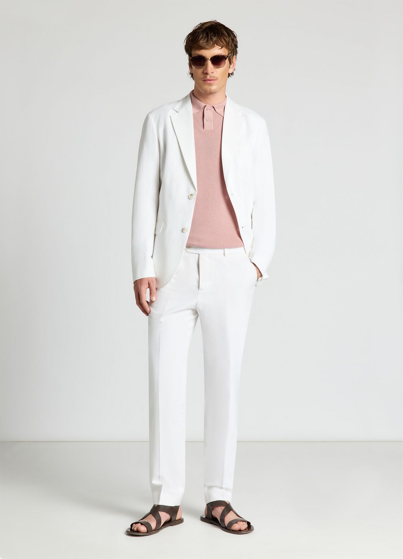 Pantaloni sartoriali con piega e tasche a filetto