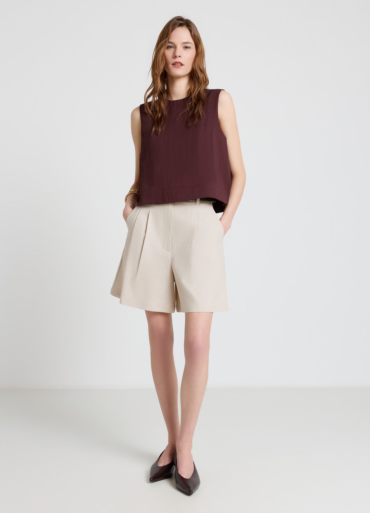 Blusa smanicata a tinta unita