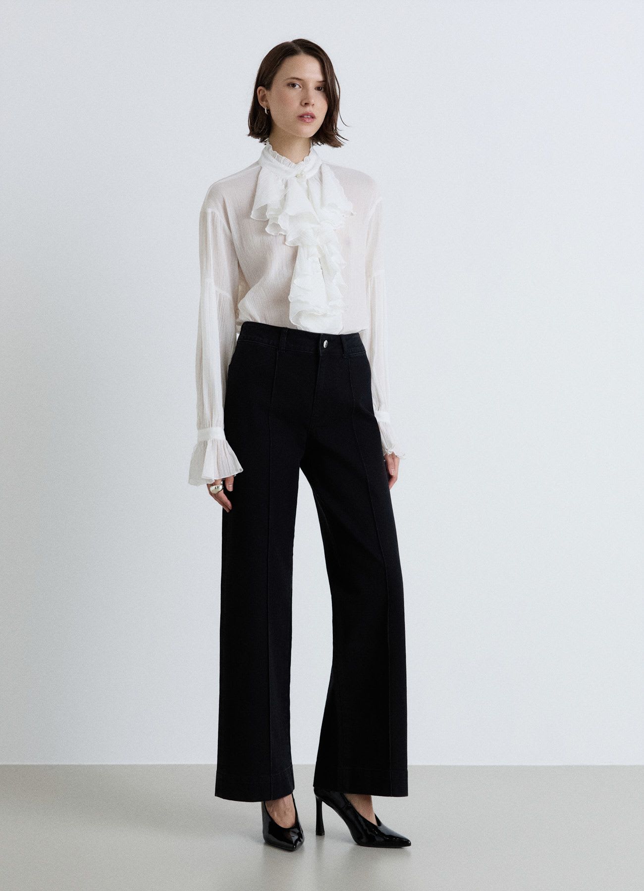 Jeans wide leg con pieghe