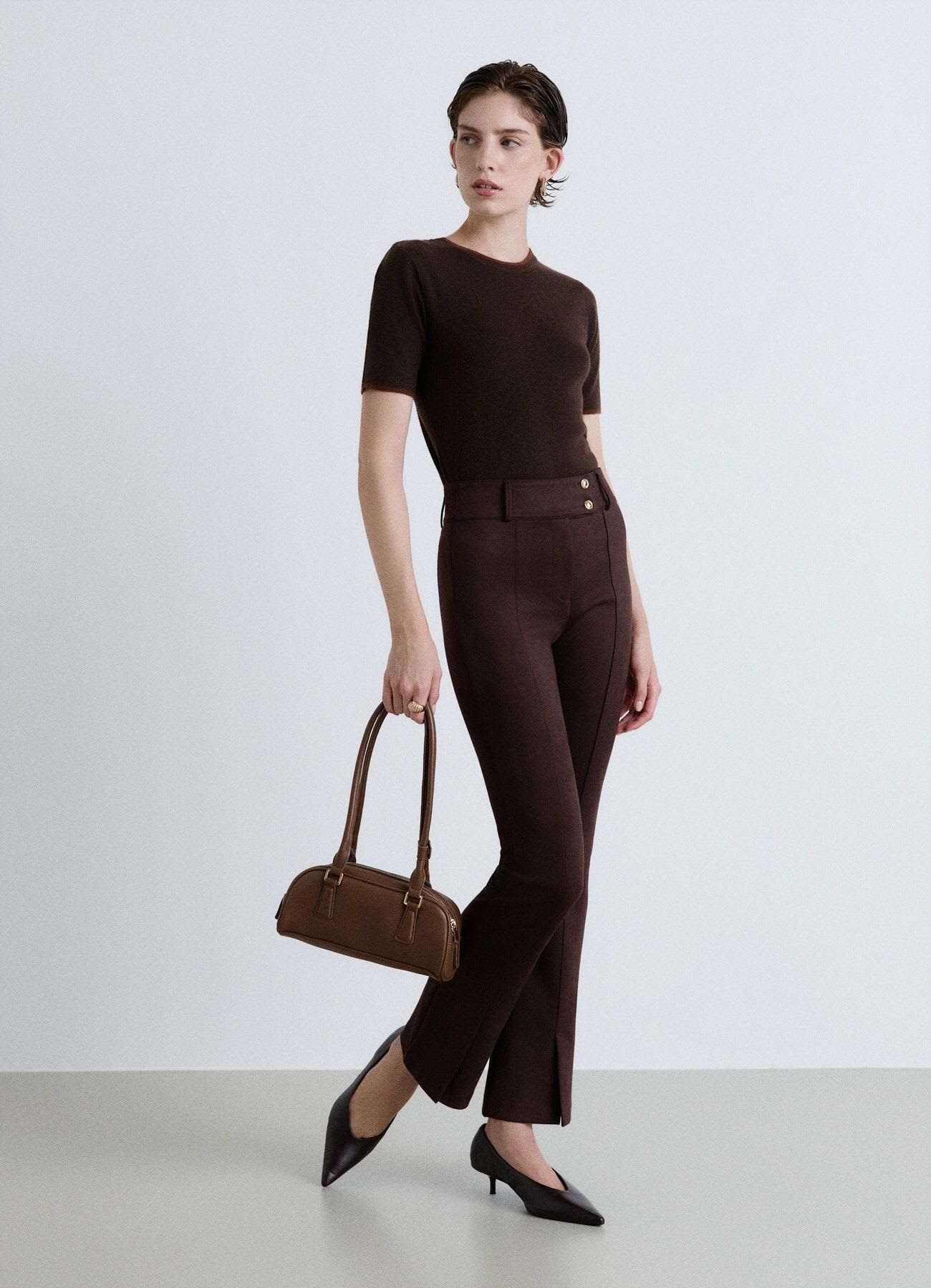 Pantaloni bootcut a vita alta con doppio bottone