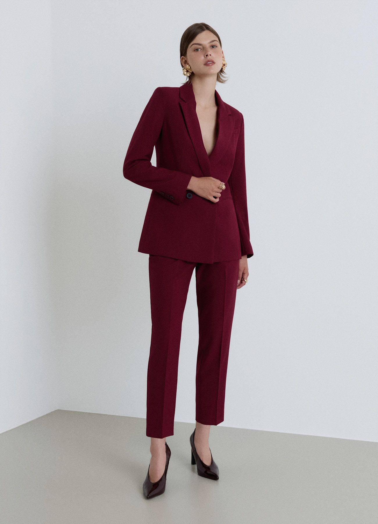 Pantaloni con pinces e vita elasticizzata