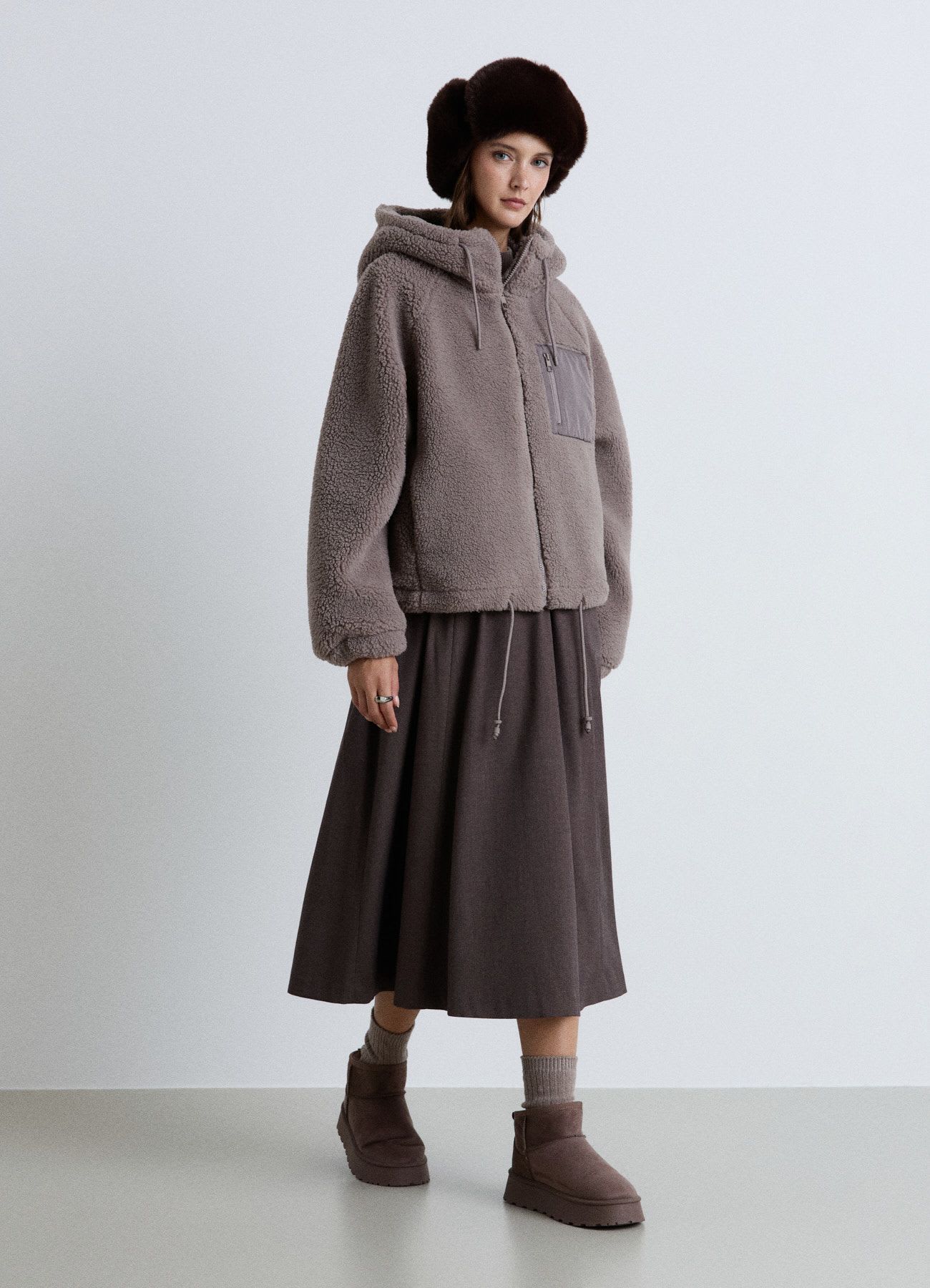 Giubbotto teddy con cappuccio e zip