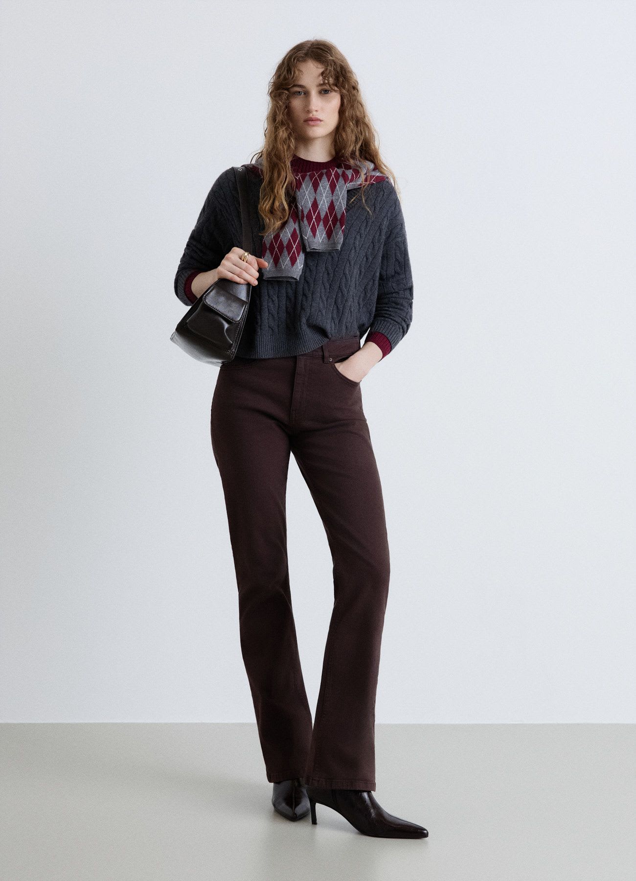 Maglia a trecce con scollo a V
