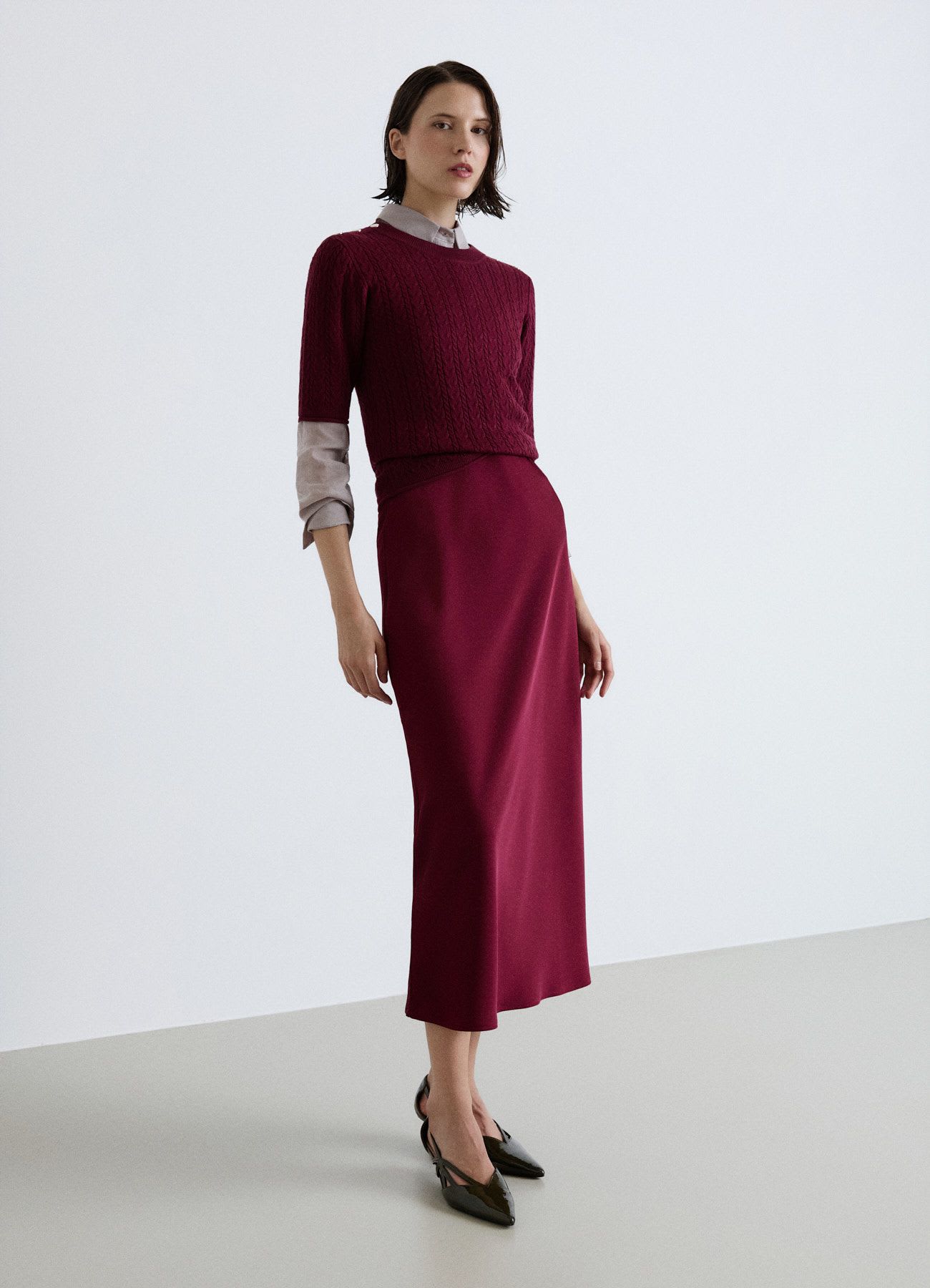T-shirt in maglia a trecce con bottoni sulle spalle