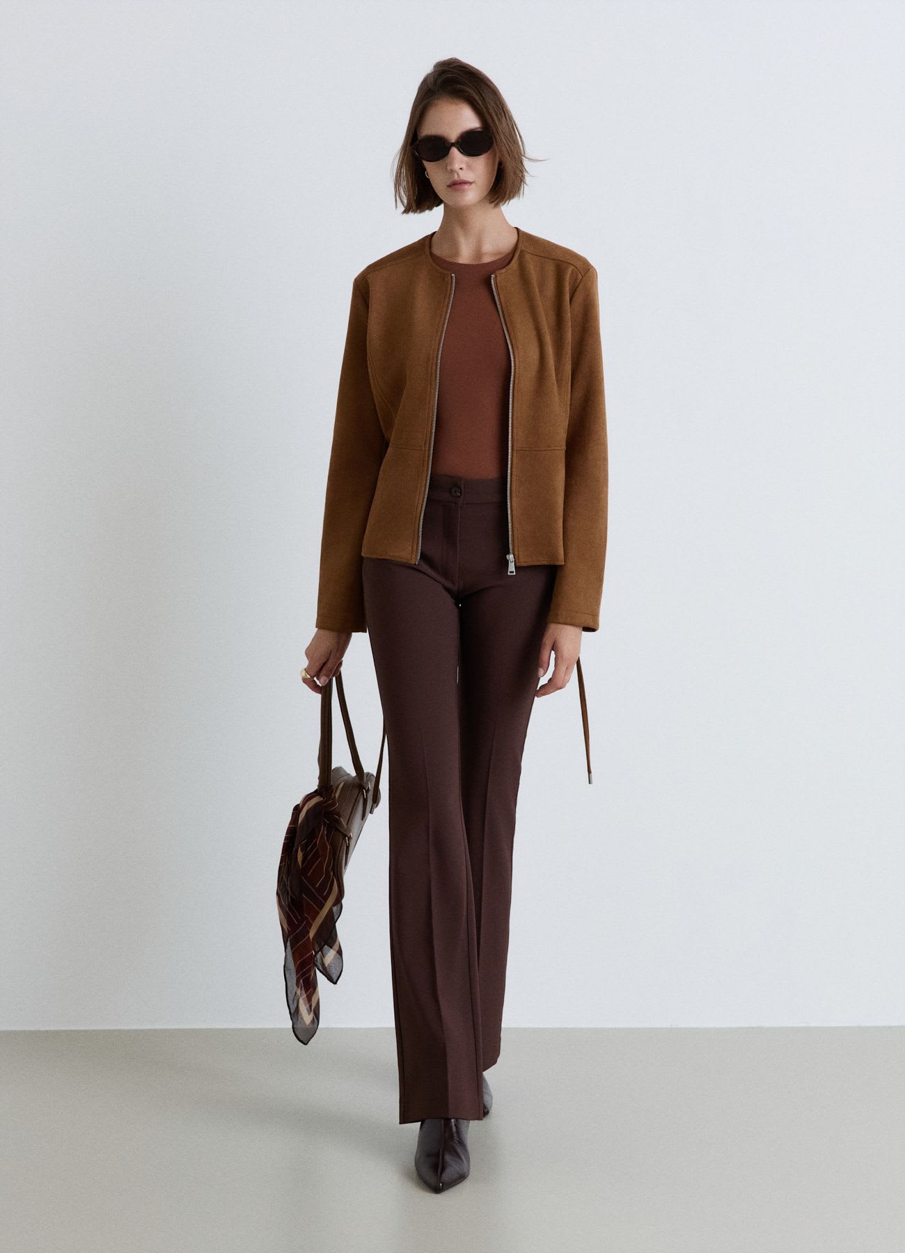 Giacca con zip e cintura in vita