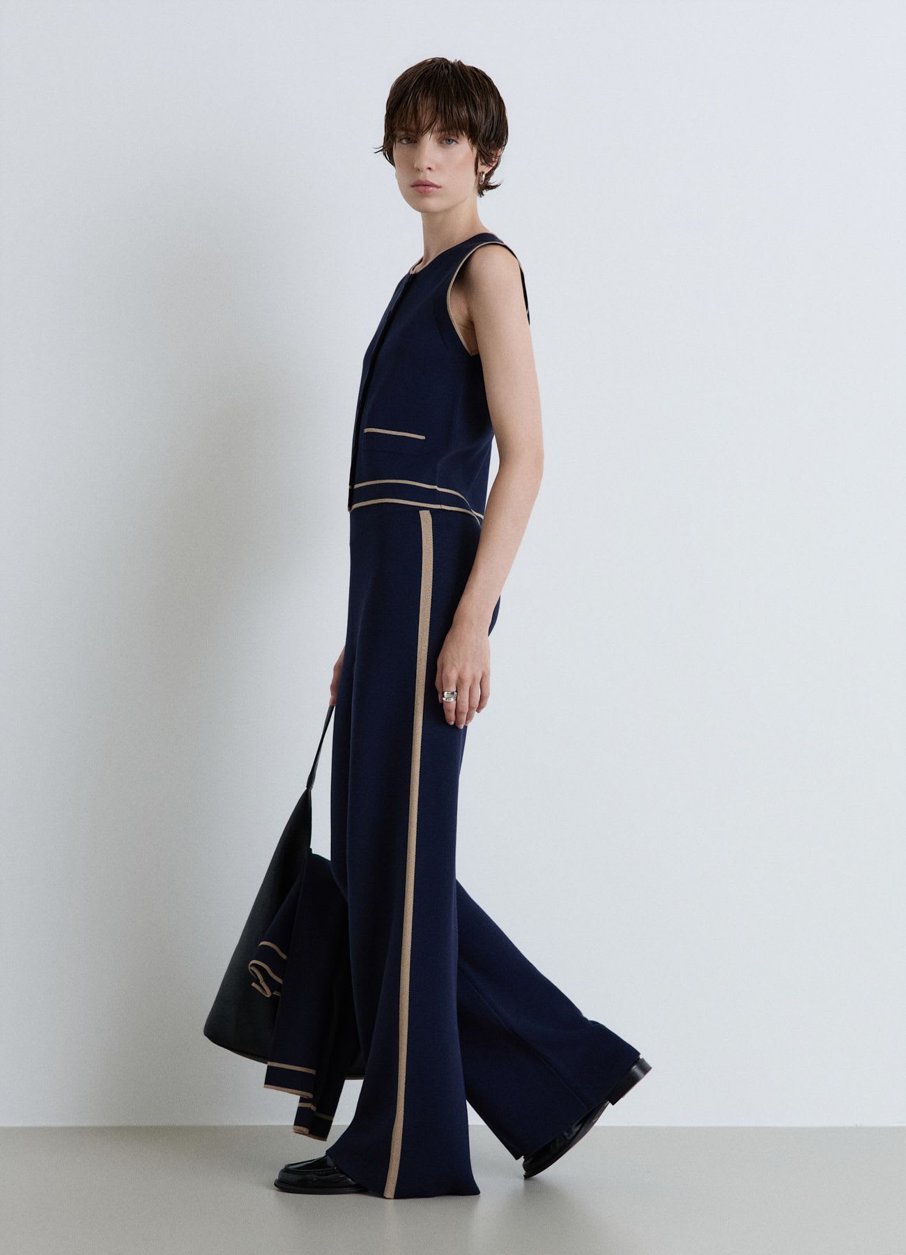 Pantaloni palazzo in maglia con profili