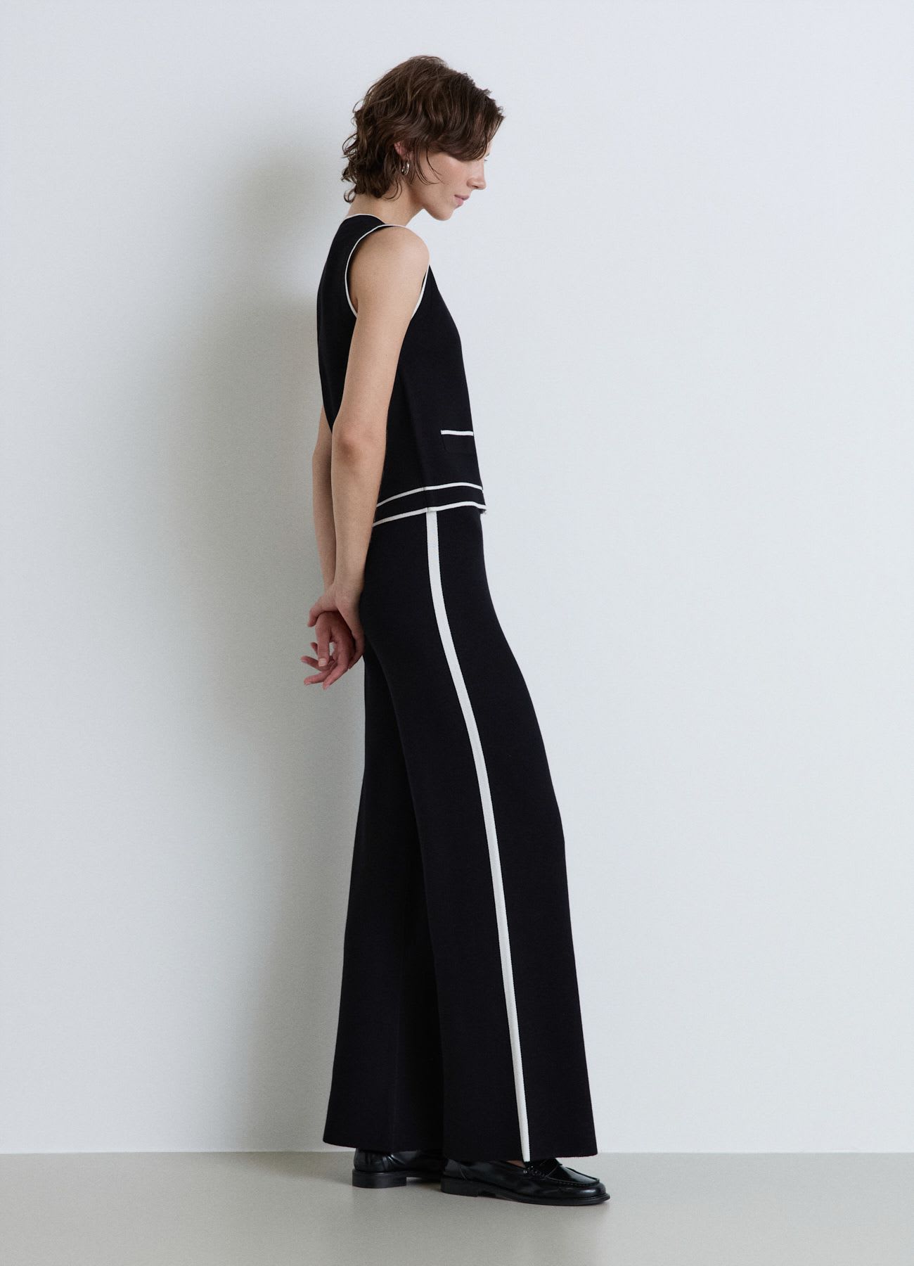 Pantaloni palazzo in maglia con profili