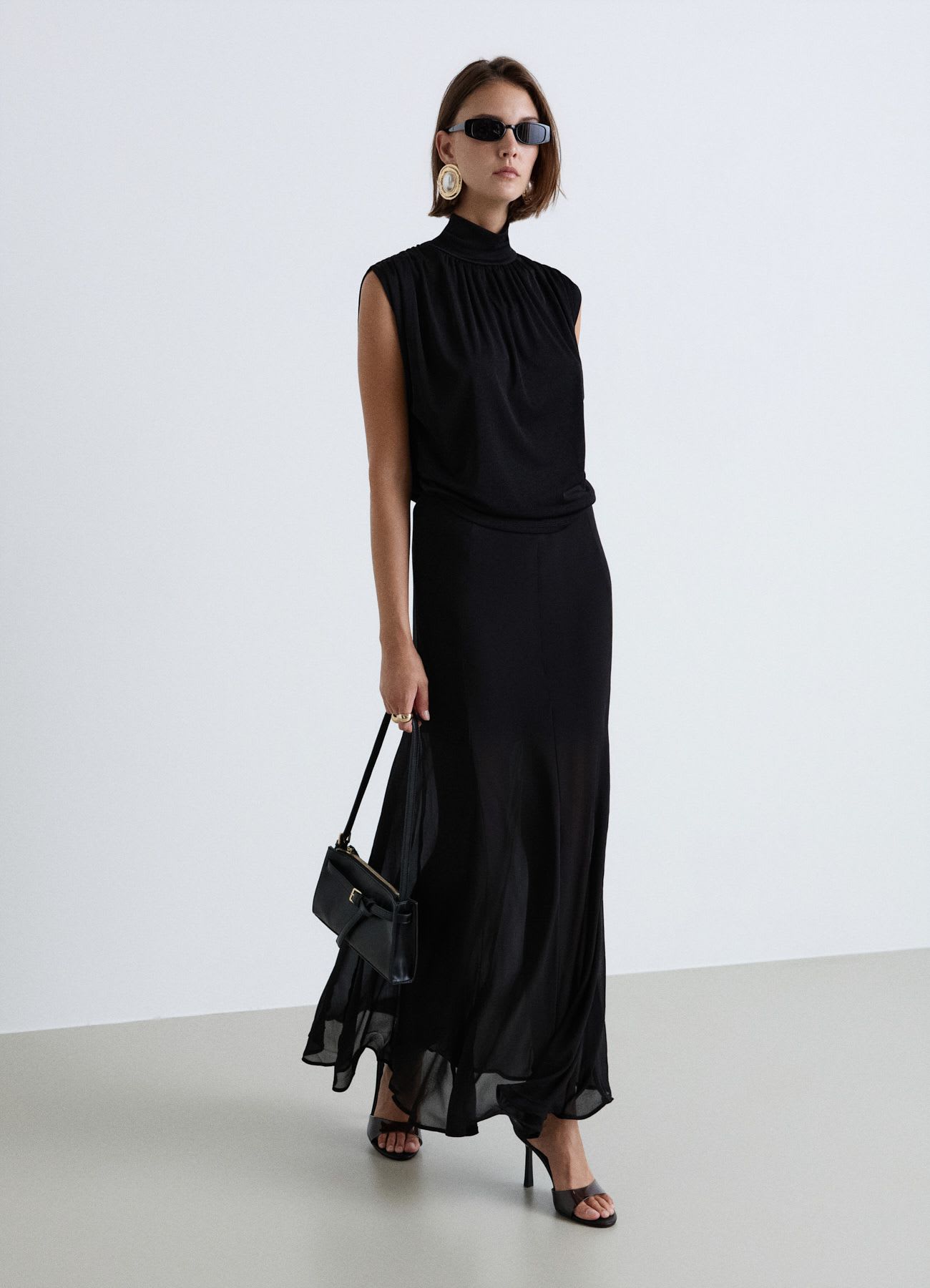 Top lupetto con schiena scoperta drappeggiata