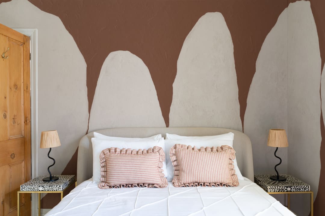 Hand-Painted Organic Form Mural in Warm Terracotta with Textured Plaster Finish