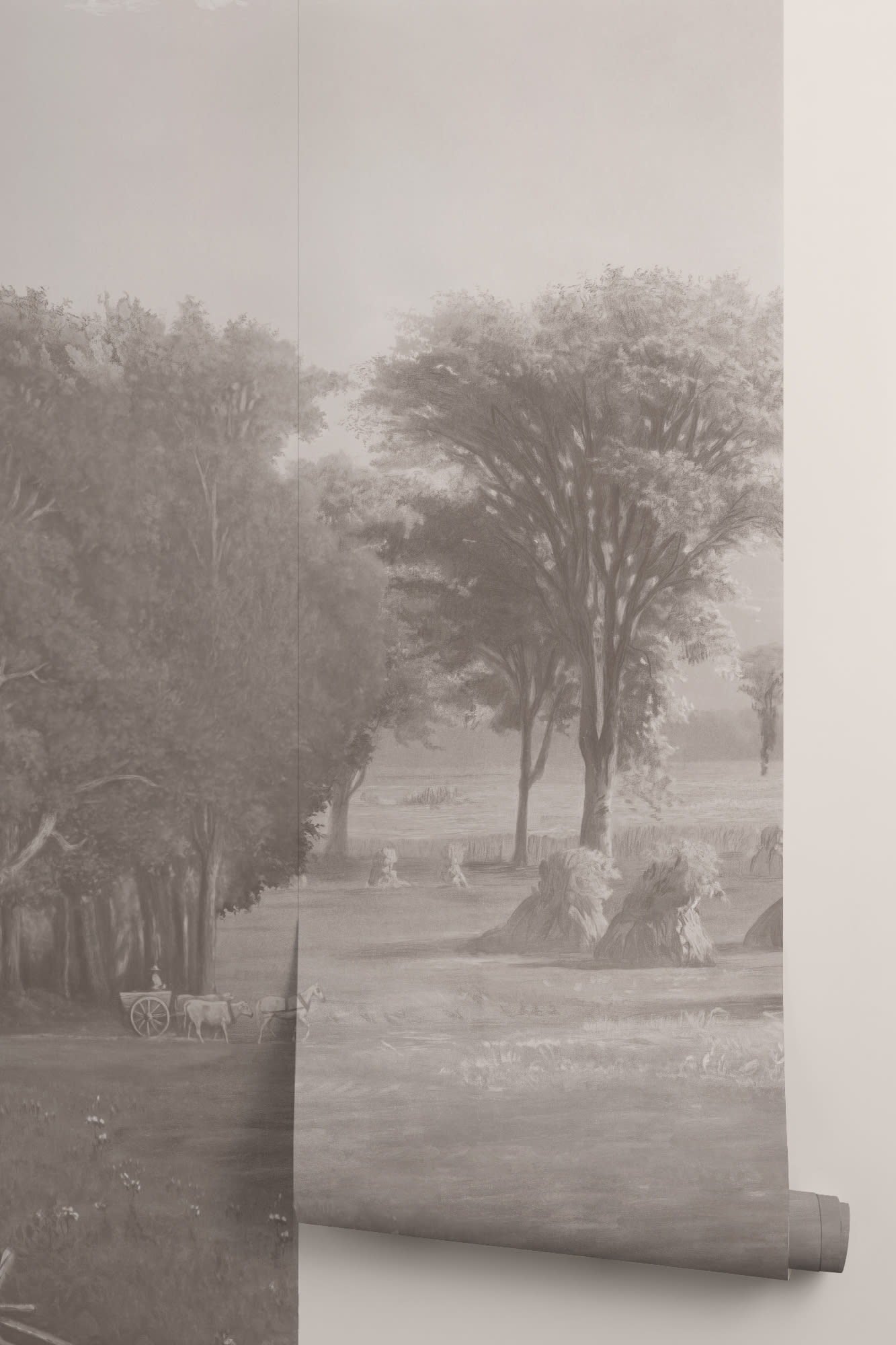 A soft gray-toned wallpaper roll displays a pastoral landscape with trees and haystacks