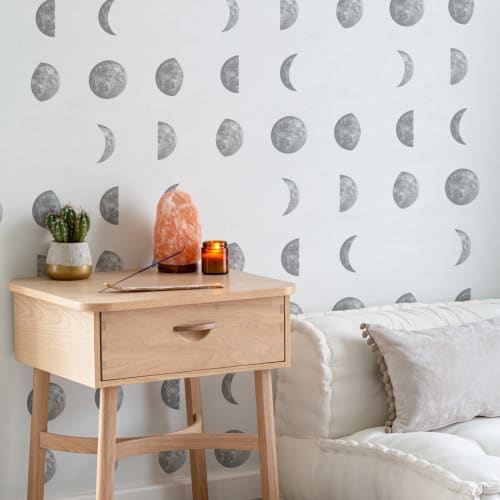 Papel de parede ilustrado com padrão de repetição das fases da lua