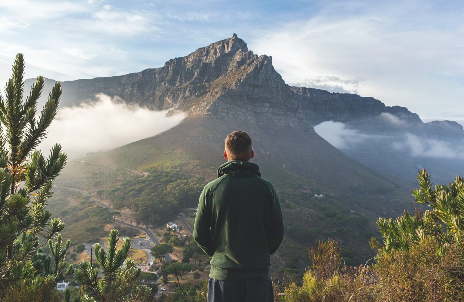 Photo of a man looking over mountains by Joshua Earle on Unsplash