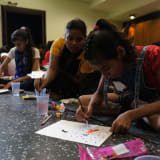 Photo of 3 young girls working on pieces of art by Yogendra Singh on Unsplash