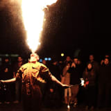 Photo of a man performing a breathing fire routine by Alex Alvarez on Unsplash