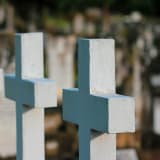 Photo of white crosses by Sandy Millar on Unsplash