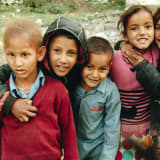 Photo of a group of 5 children hugging by Siddhant Soni on Unsplash