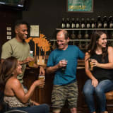 Photo of people drinking at a bar by Elevate on Unsplash