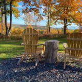Photo of timber seats sitting out in nature by MISSY STROH on Unsplash