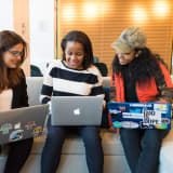 Photo of 3 woman sitting on a couch looking at laptops by Christina @ wocintechchat.com on Unsplash
