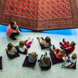Photo of children learning at the Museum on Modern Art in Warsaw by Monika Kozub on Unsplash