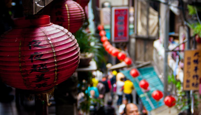 Photos of Chinese lanterns in a market by Athena Lam on Unsplash