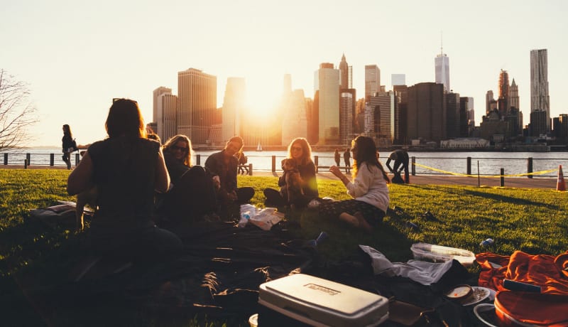 Photo of people witting in the park by Ben Duchac on Unsplash