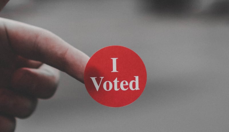 Photo of a round red sticker that says 'I Voted' by Parker Johnson on Unsplash
