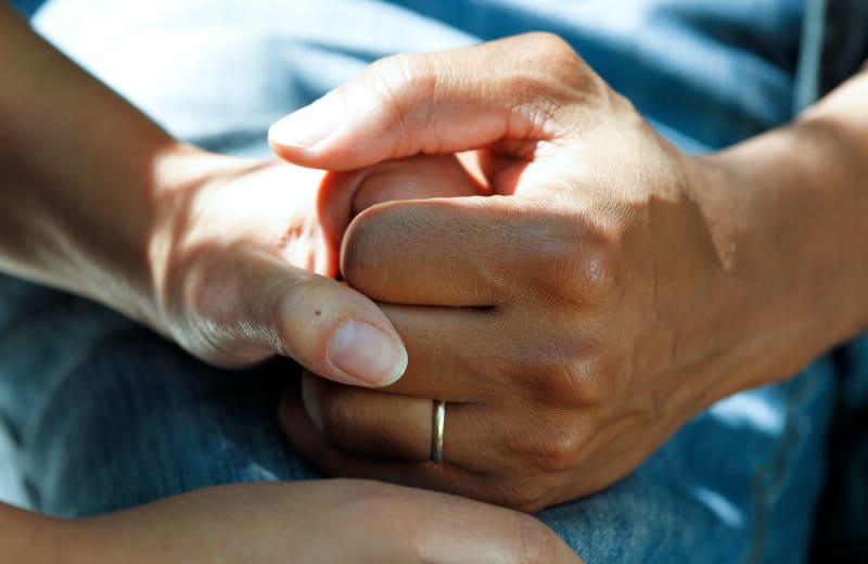 Photo of people holding hands by National Cancer Institute on Unsplash