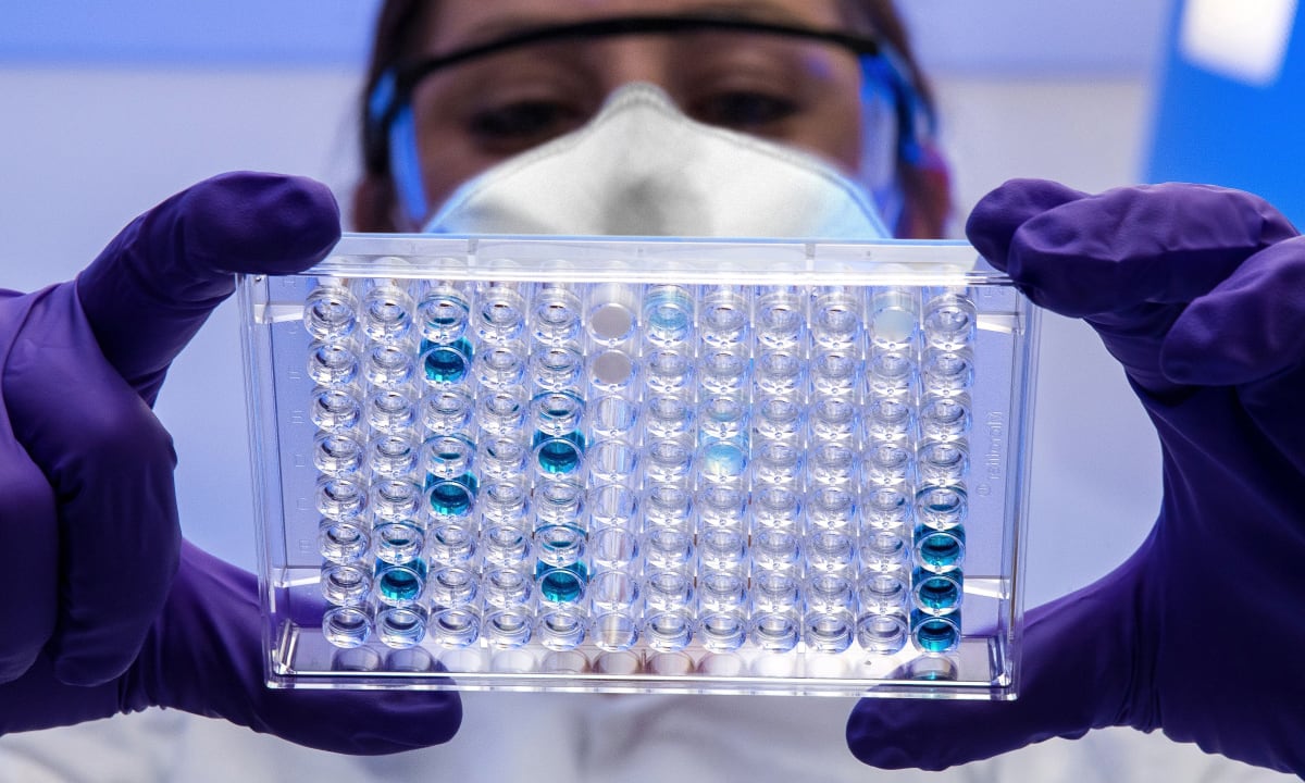 Photo of scientist looking at test samples by CDC on Unsplash