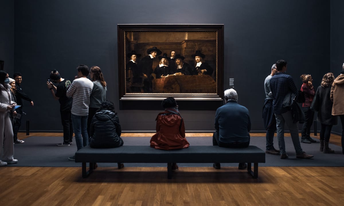 Photo of tourists in museum by redcharlie on Unsplash