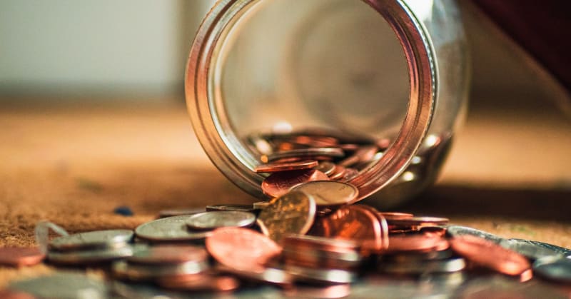 Photo of coins in a glass jar by Josh Appel on Unsplash