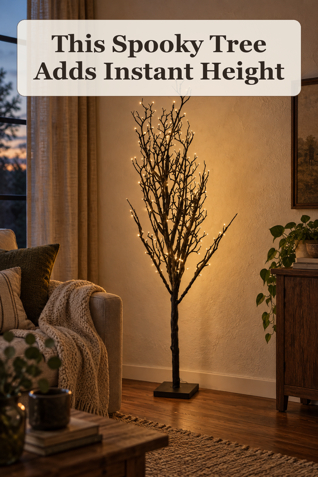 13th And Elm 48in LED Spooky Faux Branch Tree styled in a warm, lived-in Halloween setting