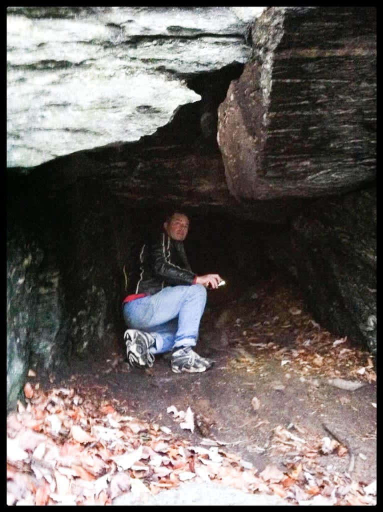 Man in small cave on Glades Road Cashiers NC