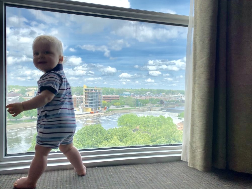 Bjorn at hotel window, looking very excited