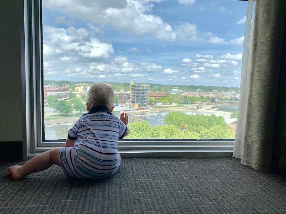 Bjorn at hotel window, sitting and gazing out