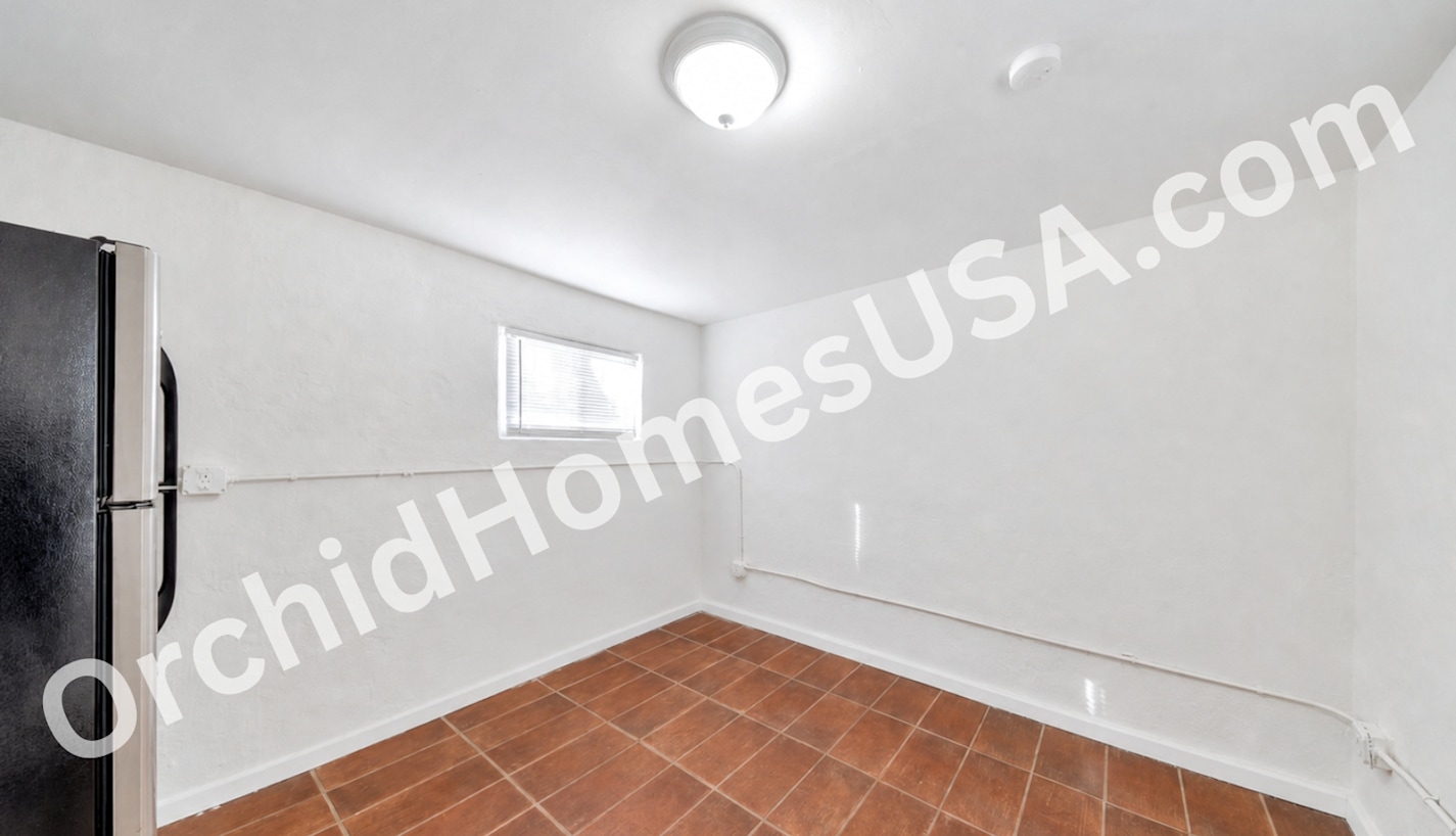 Studio living area — apartment 6 at 909 South 35th Apartments.