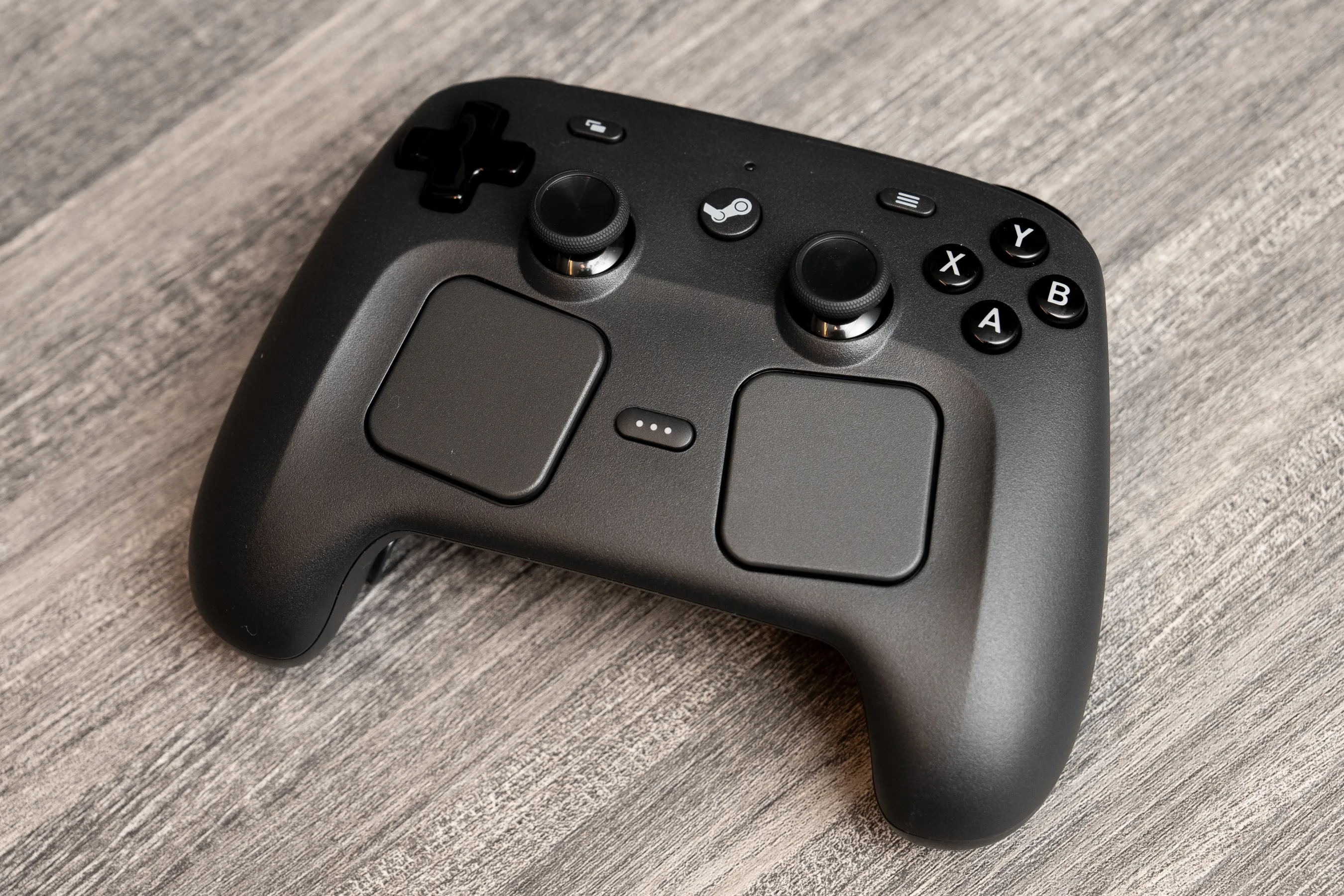 New Valve Steam Controller with dual analog sticks, capacitive touchpads, and gyro controls.