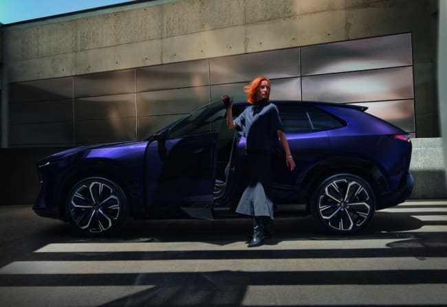 The Mazda CX-6e is dressed in dusk violet, body to seats