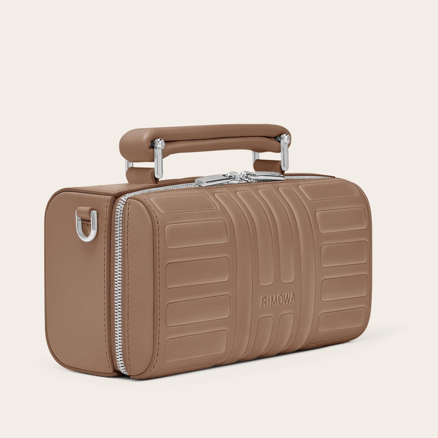 ฝั่ง Groove มี Cross-Body Bag Small กับ Zipped Pouch ในสี Umber สำหรับพกของจำเป็นแบบคล่องตัว