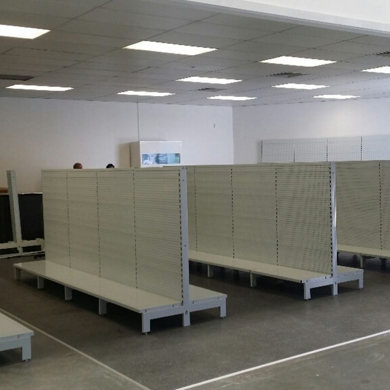 Example of Global Industrial Double Sided Gondola Shelf units in used on store.