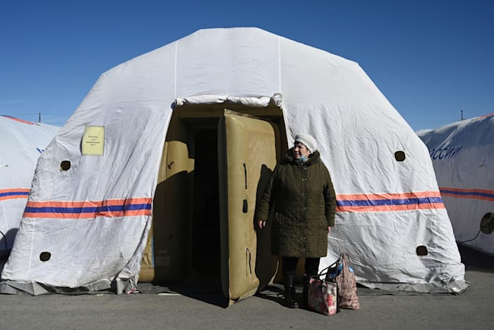 A woman evacuated from Donetsk standing in front of a tent in a refugee camp on the border with Russia / Photo: Associated Press