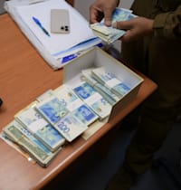 מזומן שנתפס על ידי משטרת ישראל. יש אתגרים באכיפה / צילום: דוברות משטרת ישראל