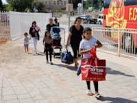 פינוי תושבים משדרות / צילום: Reuters