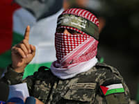 אבו עוביידה, דובר הזרוע הצבאית של חמאס / צילום: Reuters, IBRAHEEM ABU MUSTAFA