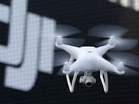 רחפן של חברת DJI הסינית / צילום: ap, Shizuo Kambayashi