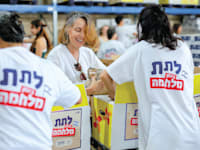 מתנדבי ארגון לתת / צילום: יקיר עמוס