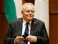 סקוט מוריסון / צילום: Reuters, Darrian Traynor ו־Jonathan Ernst