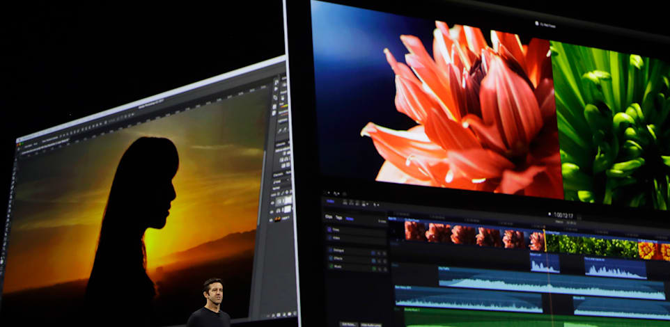 ג'ון טרנוס באחת ההכרזות של אפל / צילום: ap, Marcio Jose Sanchez